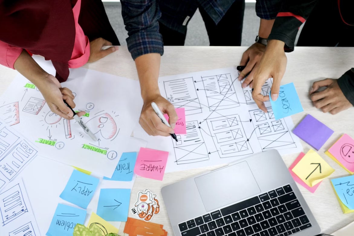 Team brainstorming during a design thinking workshop